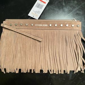 Suede Michael Kors clutch in the color taupe. Tags still attached. Never used.